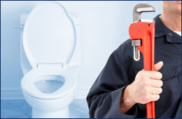plumber holding plumbing tool